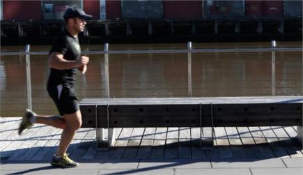 A jogger enjoys the waterfront path