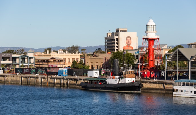 A view of the Wharf and Lighthouse with a Wonderwalls artwork visible from a distance